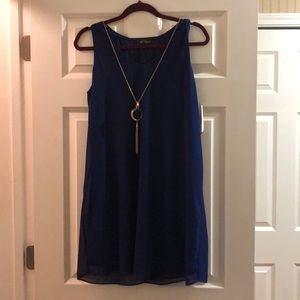 Royal blue dress with gold necklace